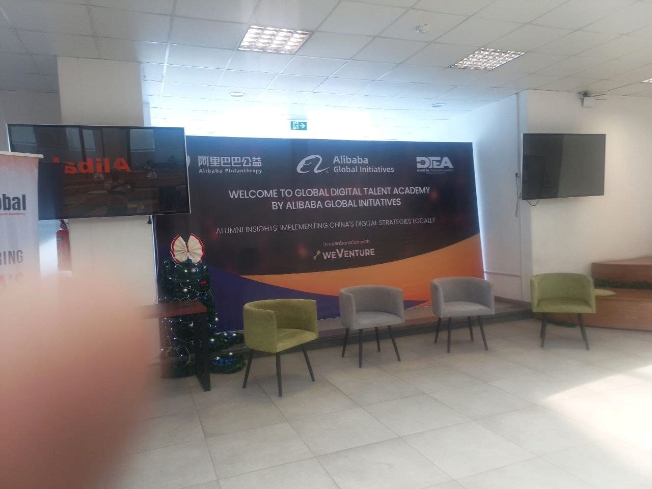 Stage backdrop for the Alibaba Global Initiatives Global Digital Talent Academy, carrying the Alibaba Philanthropy and weVenture logos