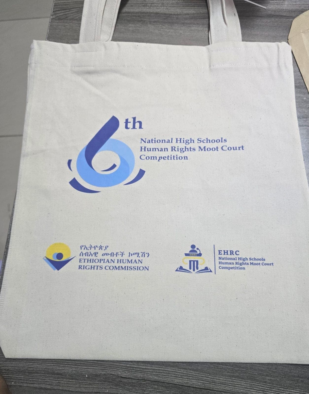 Natural canvas tote bag printed for the 6th National High Schools Human Rights Moot Court Competition
