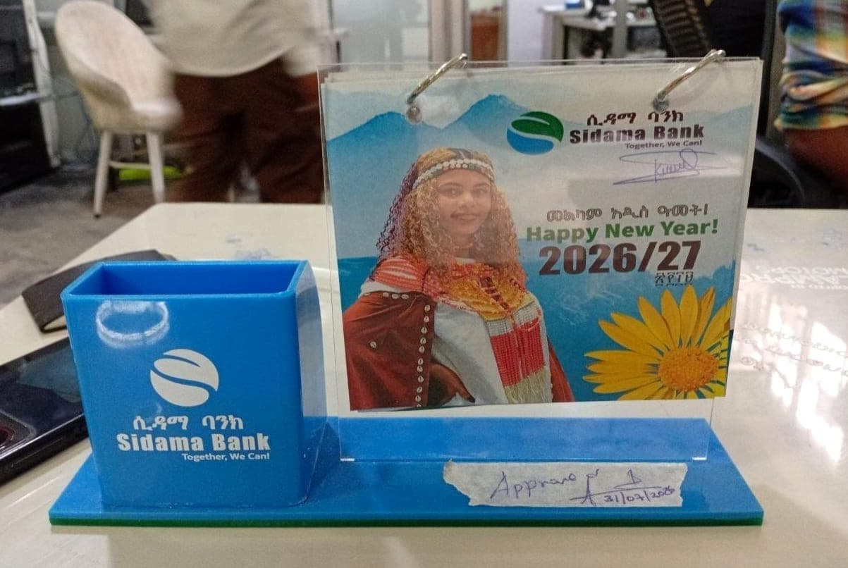 Sidama Bank branded acrylic pen holder and desk calendar